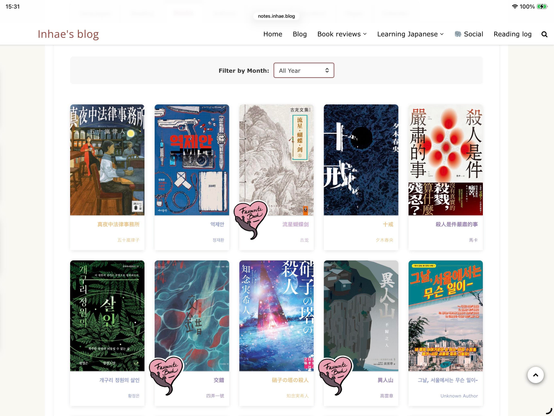 Screenshot showing a grid of book covers written in different languages. There’s a menu at the top indicating that we’re on a personal blog. The grid shows 10 book covers and three of them have a small heart sticker on their bottom left corner.