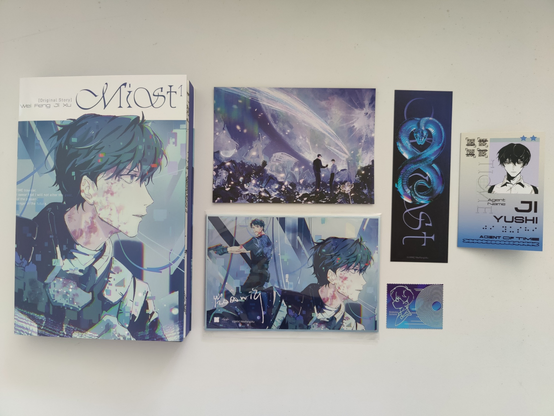 Kinokuniya edition of Mist volume 1 with all the extras laid out, including postcard, bookmark, Ji Yushi time agent card, and the shikishi + small stamp sized holo print.